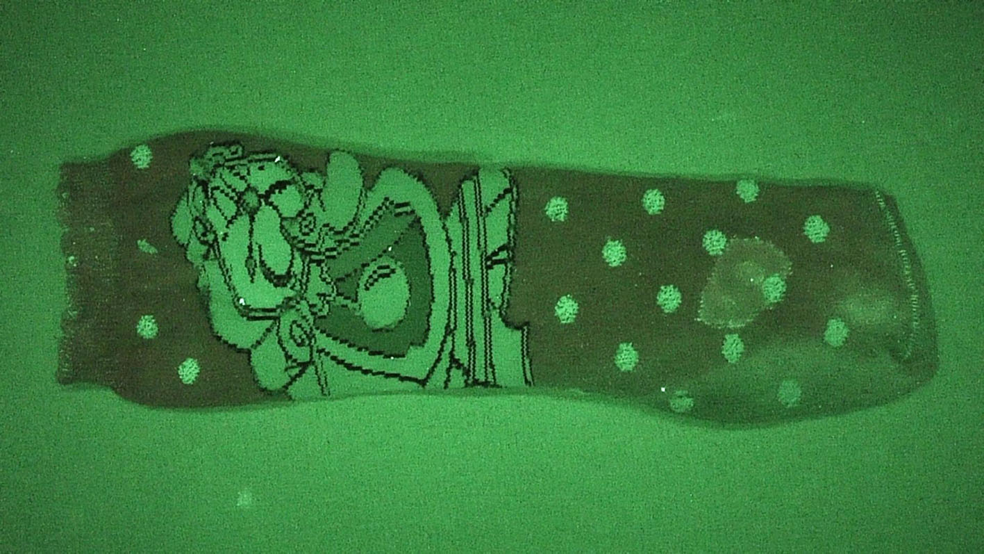 Semen covered sock under a bandpass filter. Semen covered sock under a bandpass filter.
